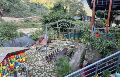 Poolside lawn at Granny's Den nature resort Uttarakhand